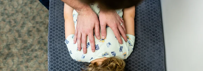 Chiropractor Grand Rapids MI Connor Knapp Adjusting Child